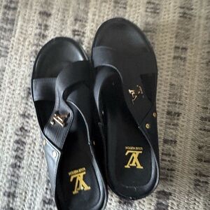 Louis Vuitton Black Slides with Gold Logo